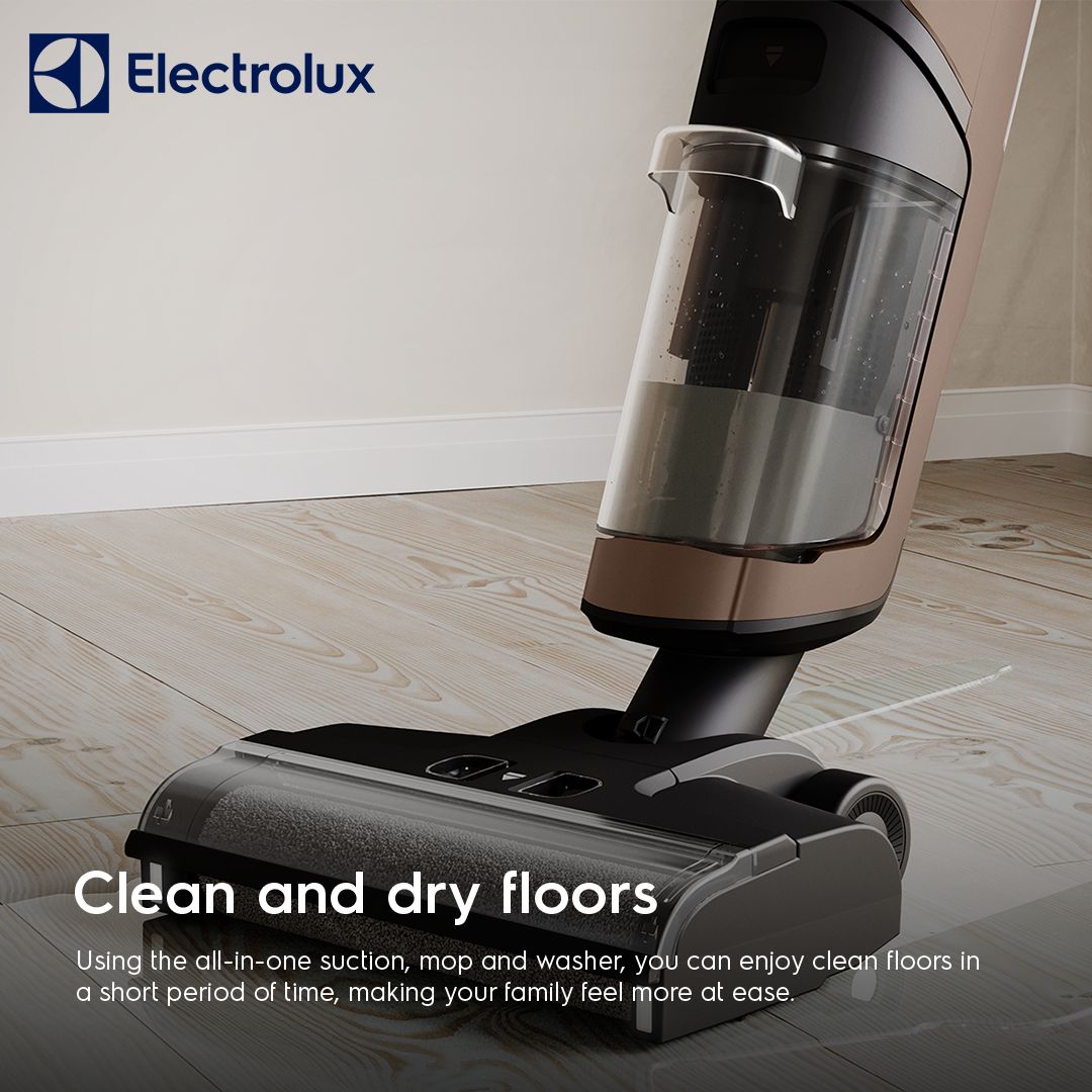 Electrolux wet and dry vacuum, low angle on a wooden floor showing the water tank and brush head
