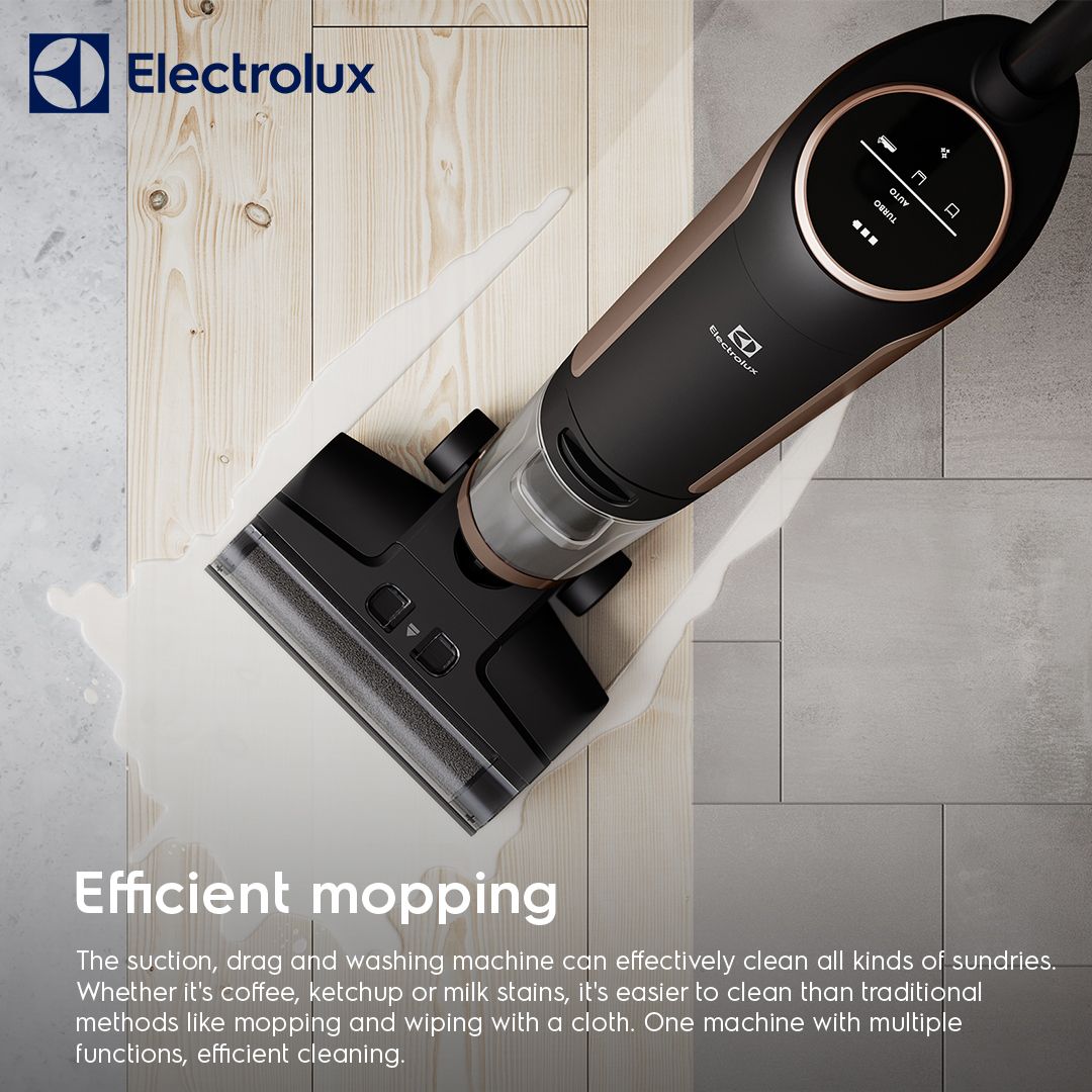 Electrolux wet and dry vacuum mopping a spill across wood and tile flooring